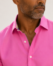 Load image into Gallery viewer, Man wearing a bright pink shirt with a neutral background