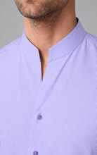 Load image into Gallery viewer, Close-up of a person wearing a light purple striped shirt with a collar.